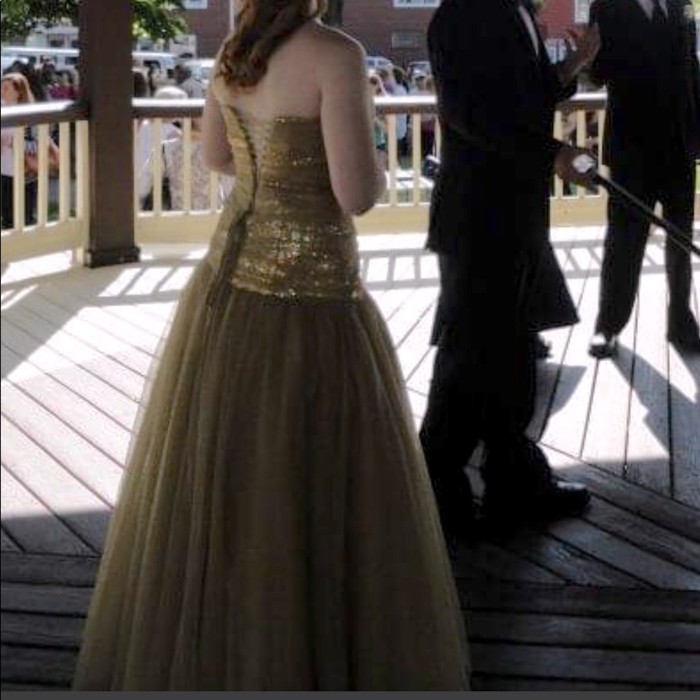 Metallic gold sleeveless prom dress.